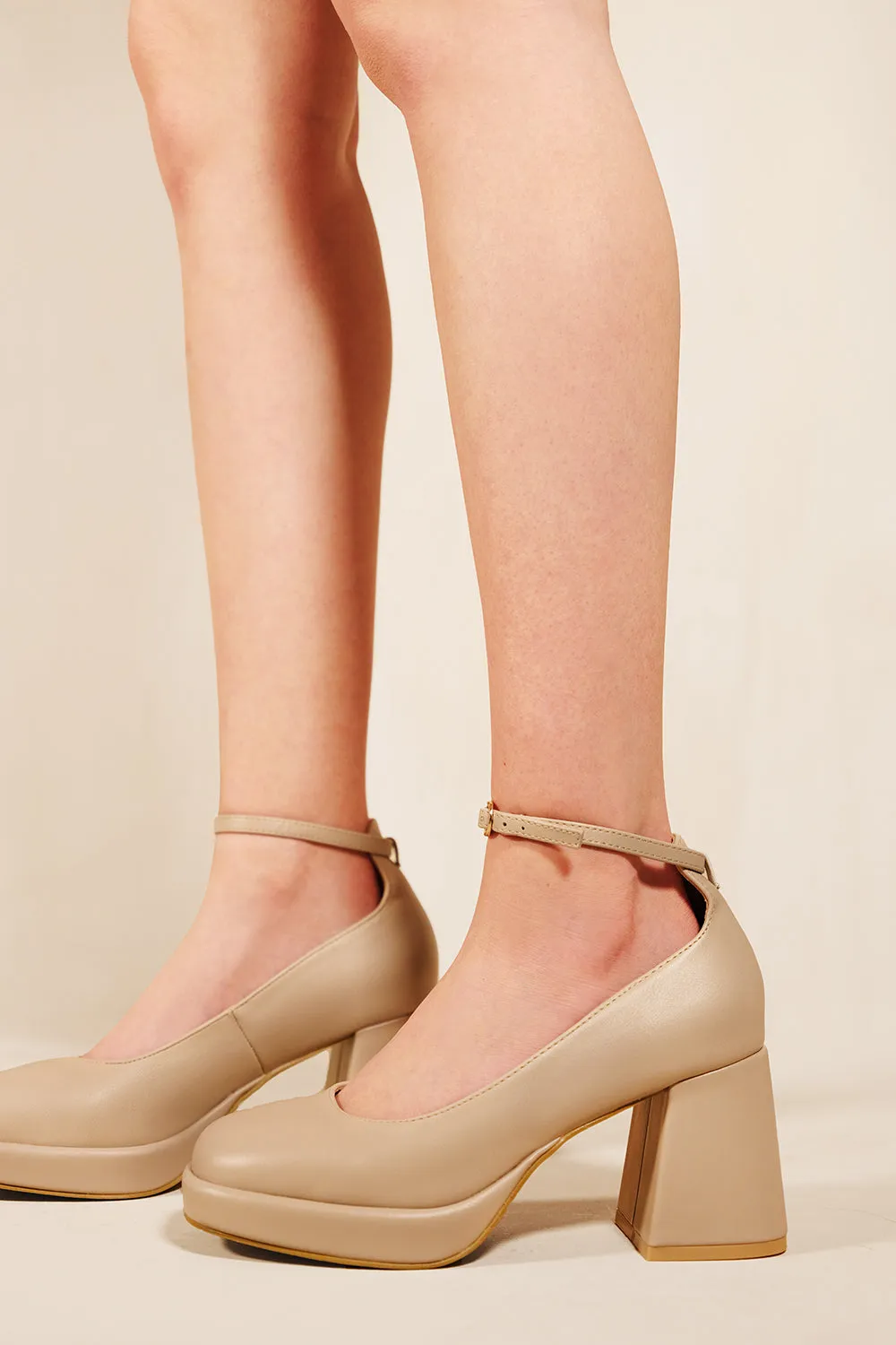 MAKANI BLOCK HEEL COURT SHOES WITH ANKLE STRAP IN NUDE FAUX LEATHER